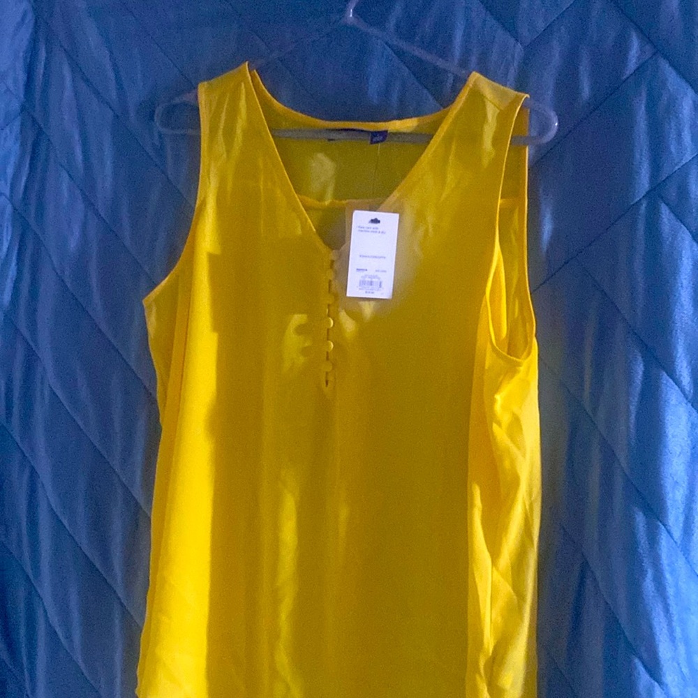 Never worn! Canary yellow, sleeveless tank with buttons in front, size large.